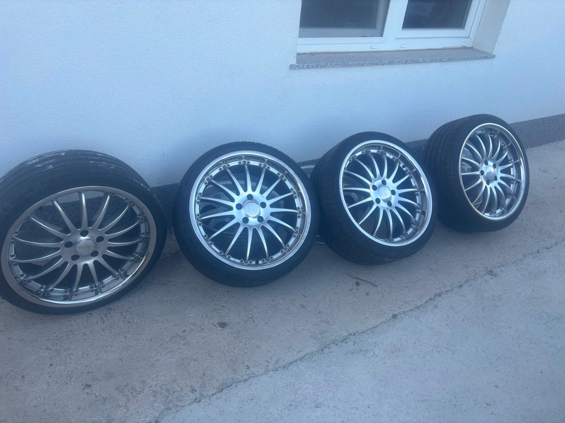 Set of four polished multi-spoke alloy wheels with fresh tires